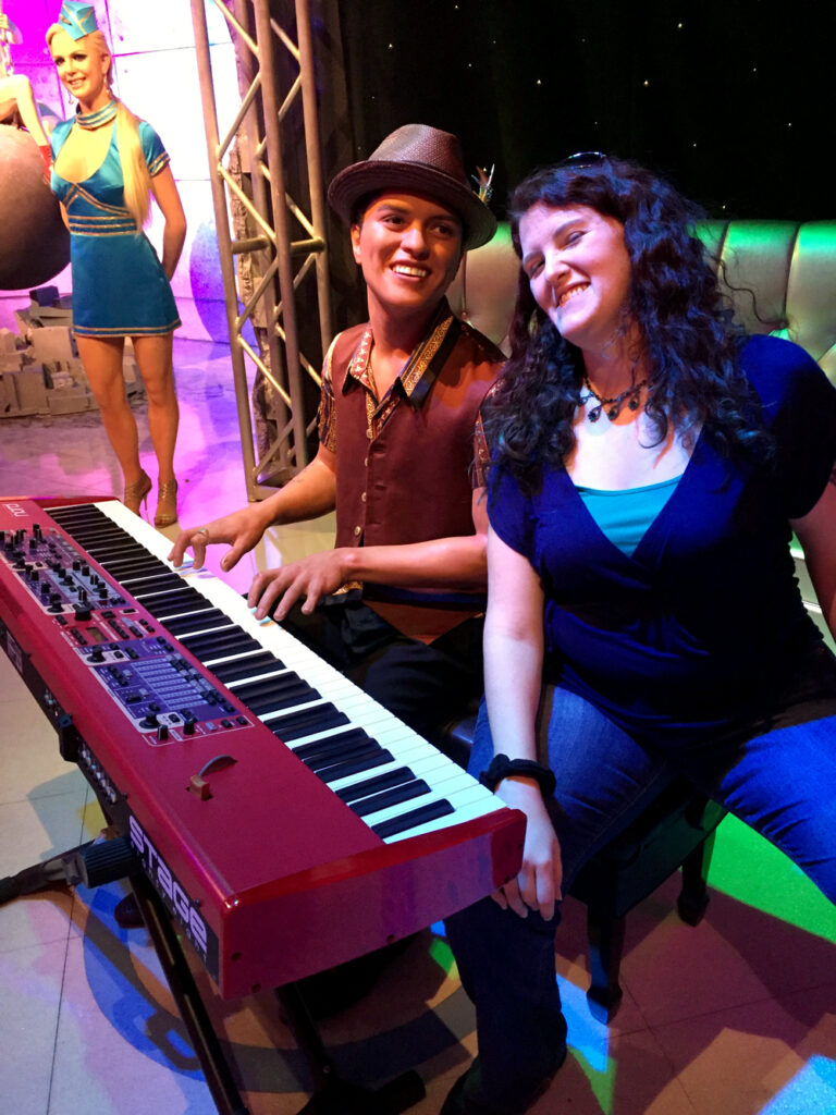 Wax figure of Bruno Mars at piano