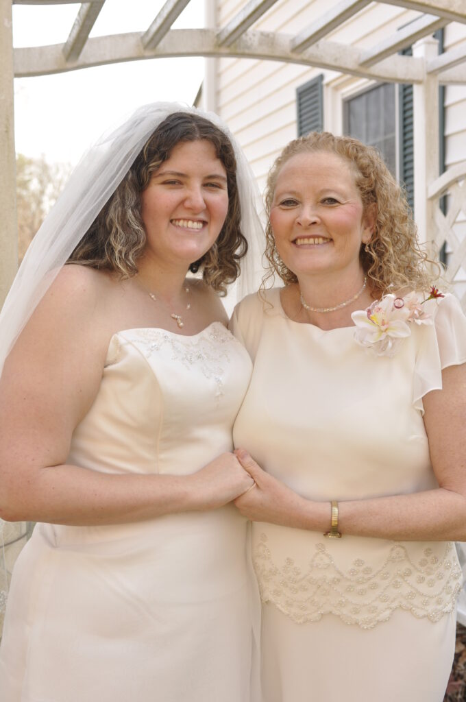 Bride and mother standing next to each other